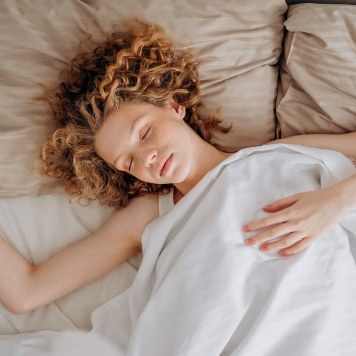 what-to-do-day-after-treatment-sq Person resting in bed the day after infusion therapy